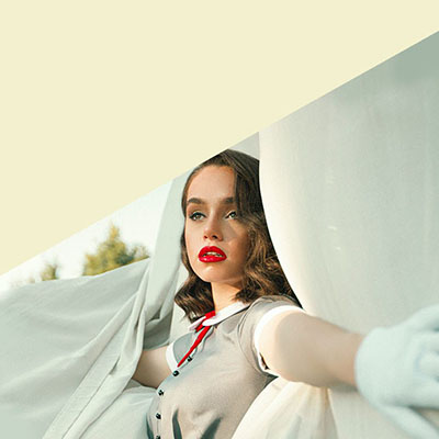 image of a young woman dressed up in a white summer dress