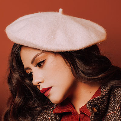 a model wearing a white hat for women